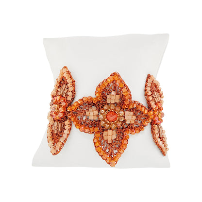 Flamme Mix Orchid Bloom Maxi Bracelet featuring three hand-crocheted copper wire flowers with orange and peach crystals, finished with gold-tone magnetic clasp.