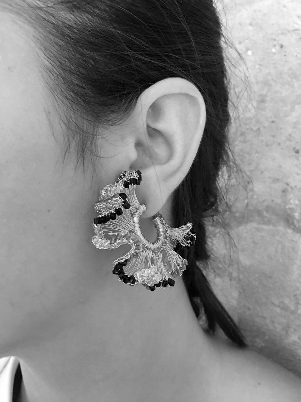 Shop Green & Gold Rio Hoops, handcrafted in Brazil with rich green crystals and 18K gold-filled wire in Lavish’s signature ruffled crochet design.