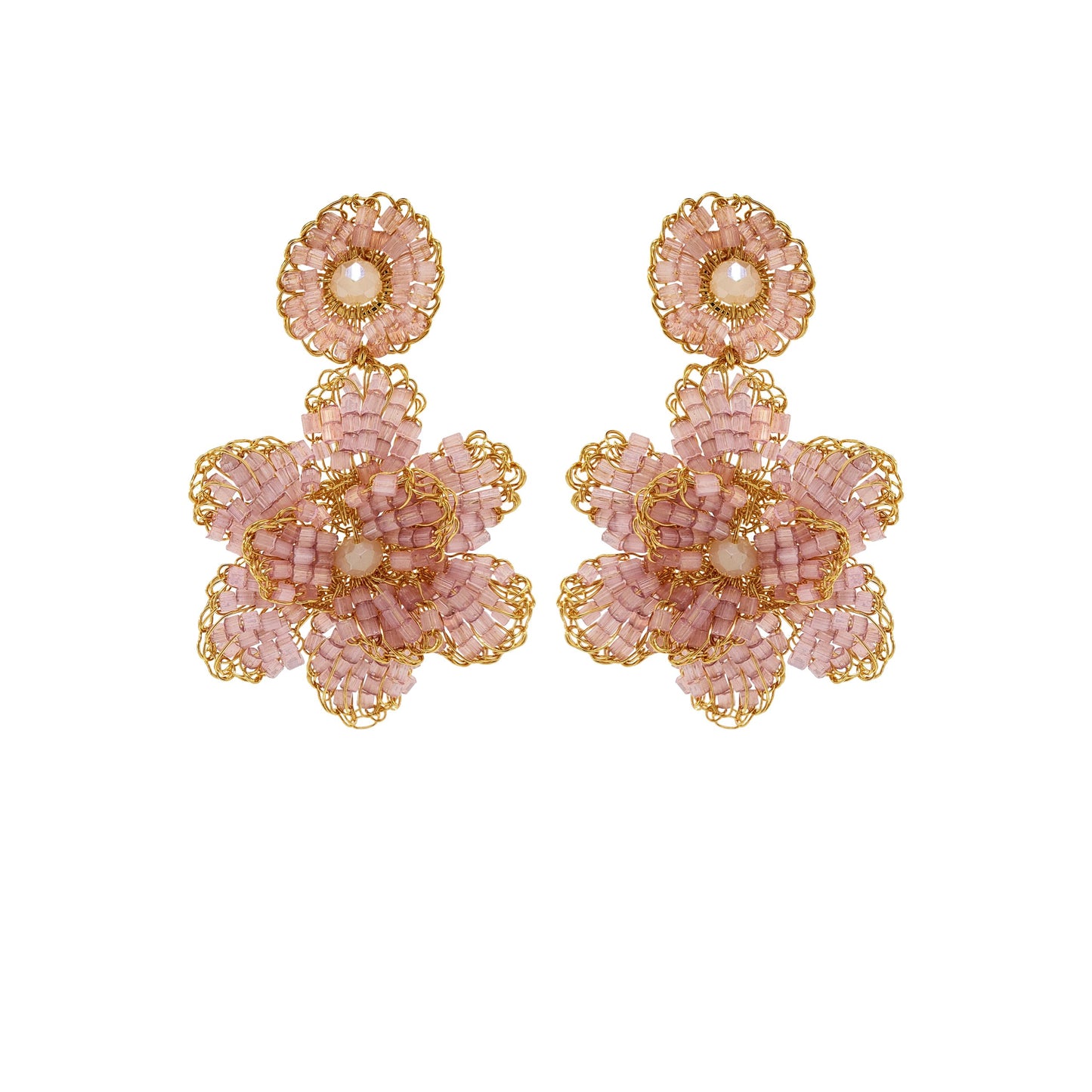 A pair of hand-crocheted earrings with gold and pink detailing, resembling a floral pattern, displayed against a plain background. Floral hand-crocheted dangle earrings handmade in Brazil with 18 karat gold filled wire and delicate mauve bead accents.