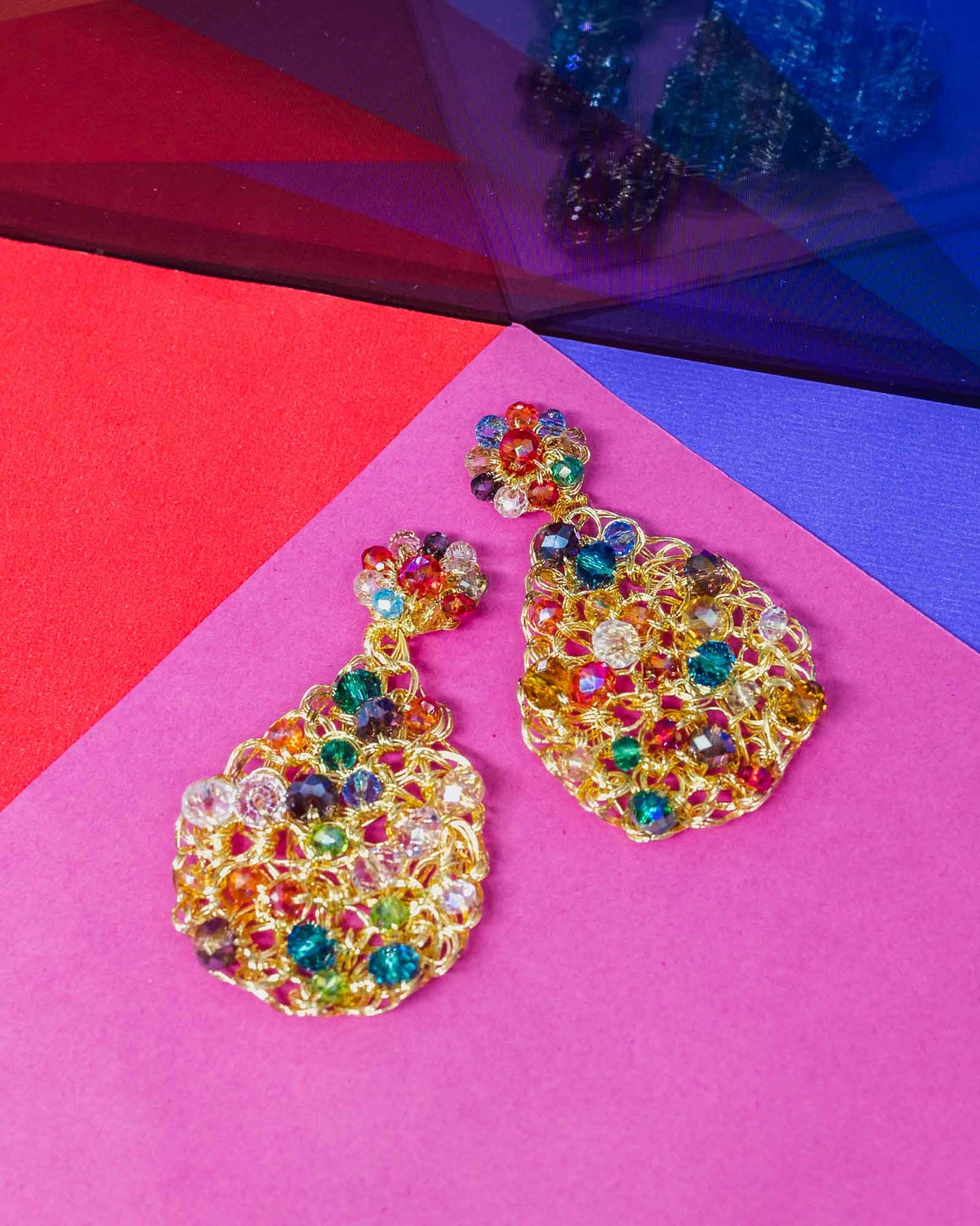 Handmade in Brazil, these teardrop mesh earrings feature 18 karat gold filled wire, multicolor crystals, lightweight comfort, and hypoallergenic materials.