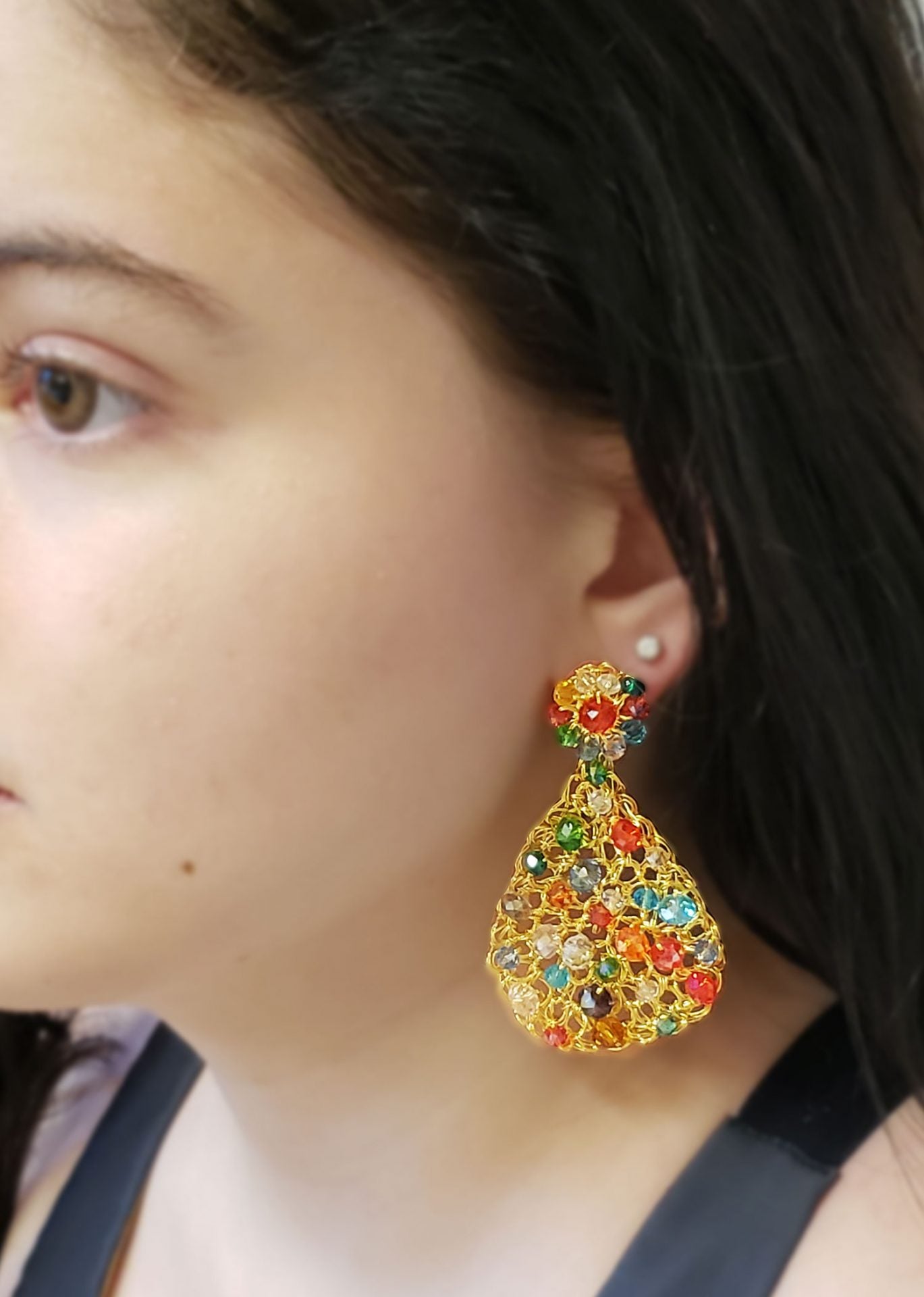 Handmade in Brazil, these teardrop mesh earrings feature 18 karat gold filled wire, multicolor crystals, lightweight comfort, and hypoallergenic materials