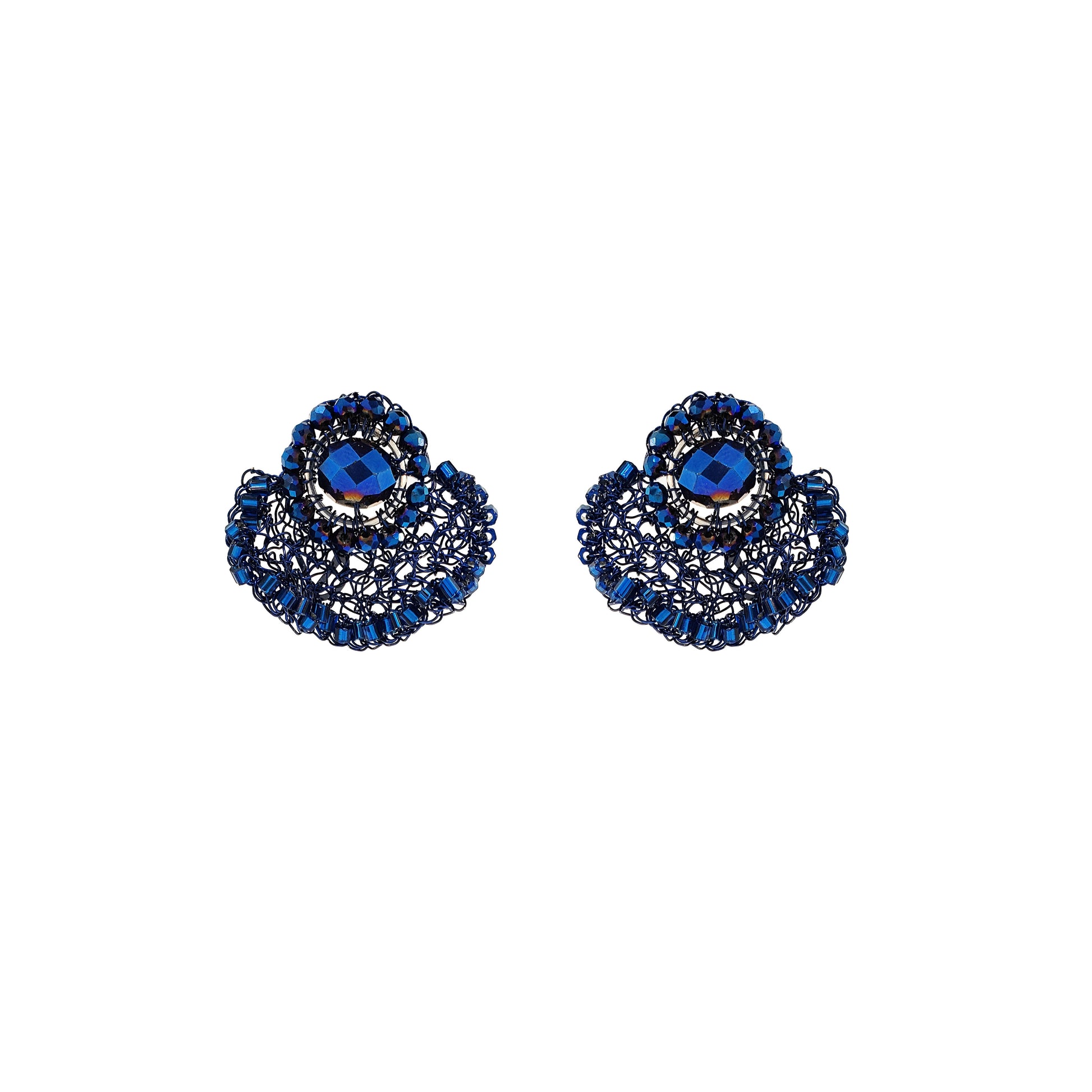 Pair of blue gemstone earrings on a white background. Hand-crocheted navy blue crystal earrings with glass beads and enameled copper wire, handmade in Brazil.