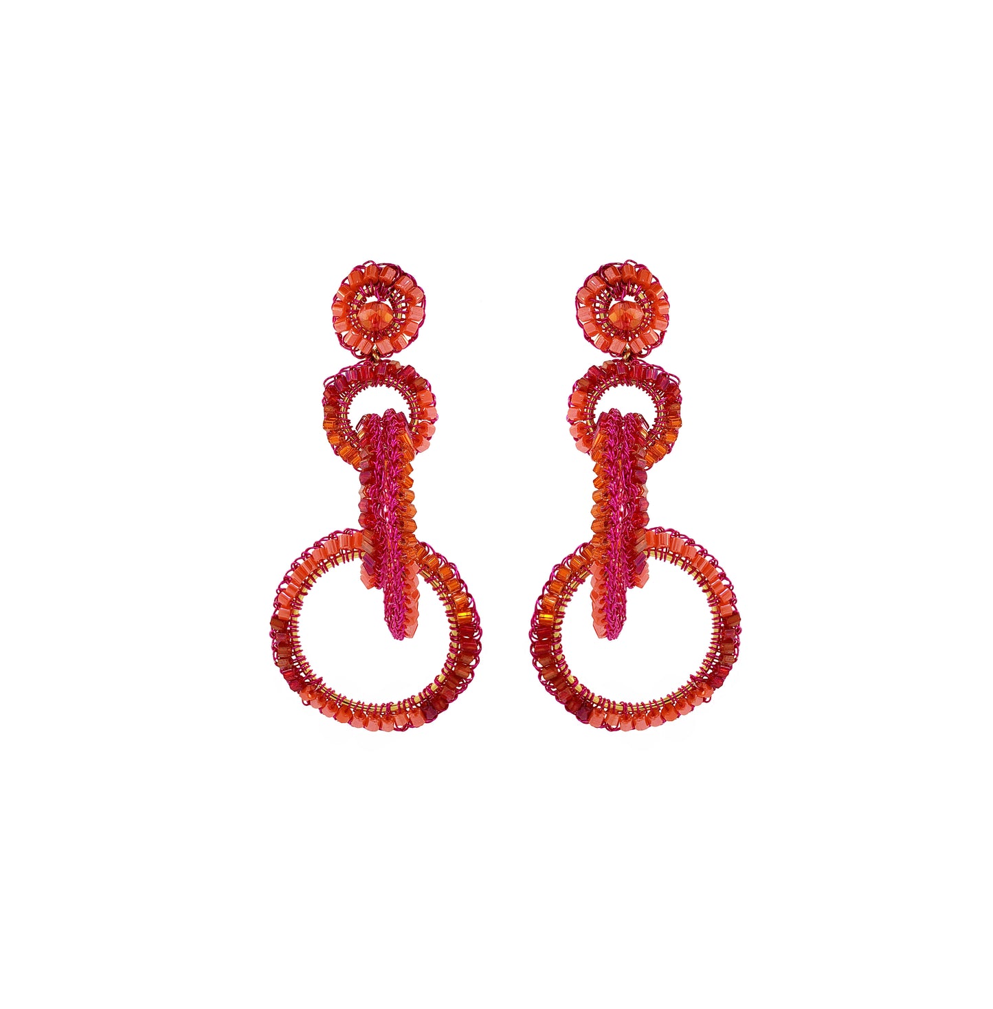 A pair of hand-crocheted hoop earrings with fuchsia and orange enameled wires, adorned with pink crystals. Interlocked link hand-crocheted earrings handmade in Brazil with bright fuchsia and orange tones, sparkling bead accents, and layered circular links.