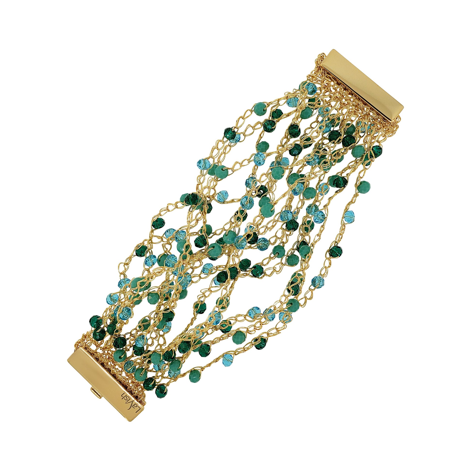 A hand-crocheted gold cuff bracelet with teal beads and a magnetic clasp. Hand-crocheted gold cuff bracelet handmade in Brazil with 18 karat gold filled wire, sparkling green and turquoise crystal accents, and magnetic clasp.