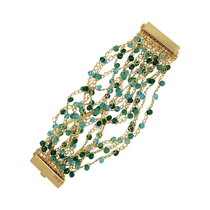 A hand-crocheted gold cuff bracelet with teal beads and a magnetic clasp. Hand-crocheted gold cuff bracelet handmade in Brazil with 18 karat gold filled wire, sparkling green and turquoise crystal accents, and magnetic clasp.