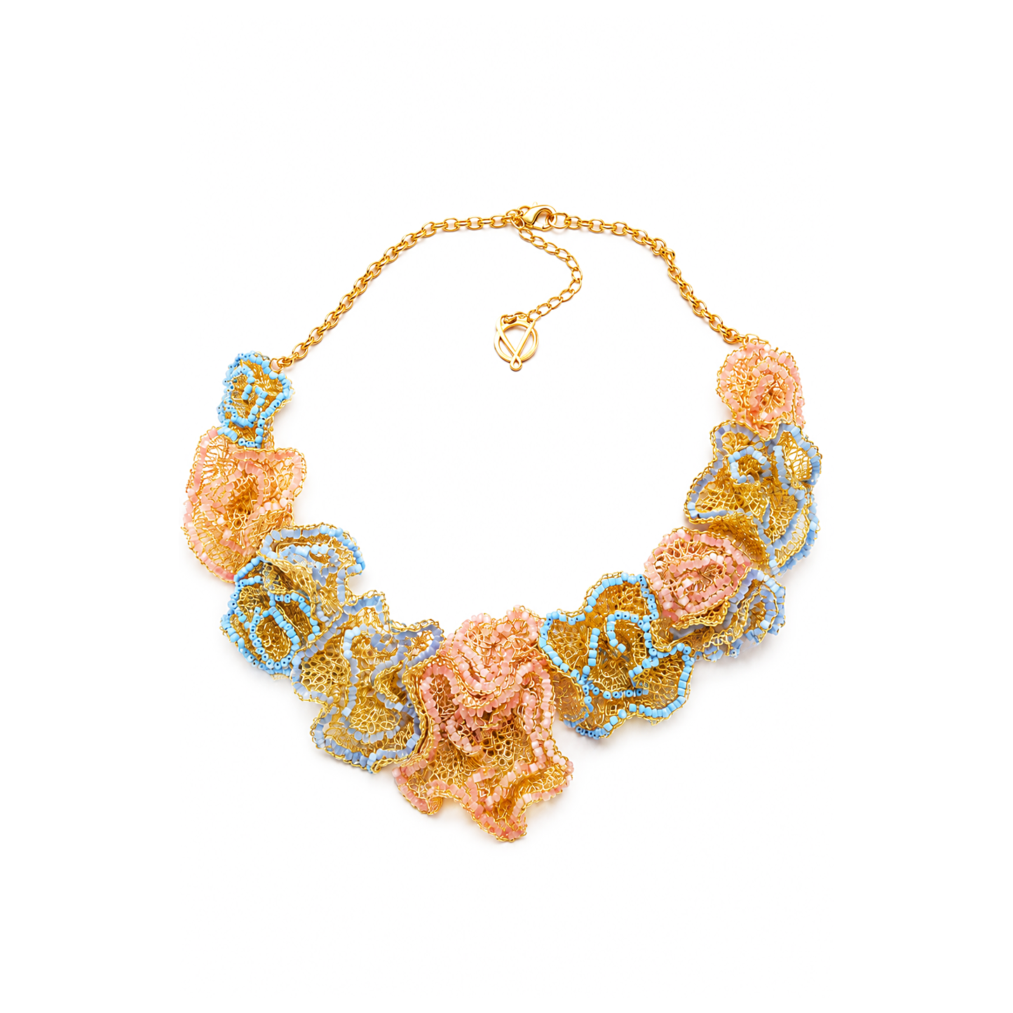 Colorful floral necklace on a white background. Hand-crocheted organic flower cascade necklace made with 18 karat gold-filled wire by Brazilian artisans. Hypoallergenic, nickel-free, and lightweight statement jewelry.