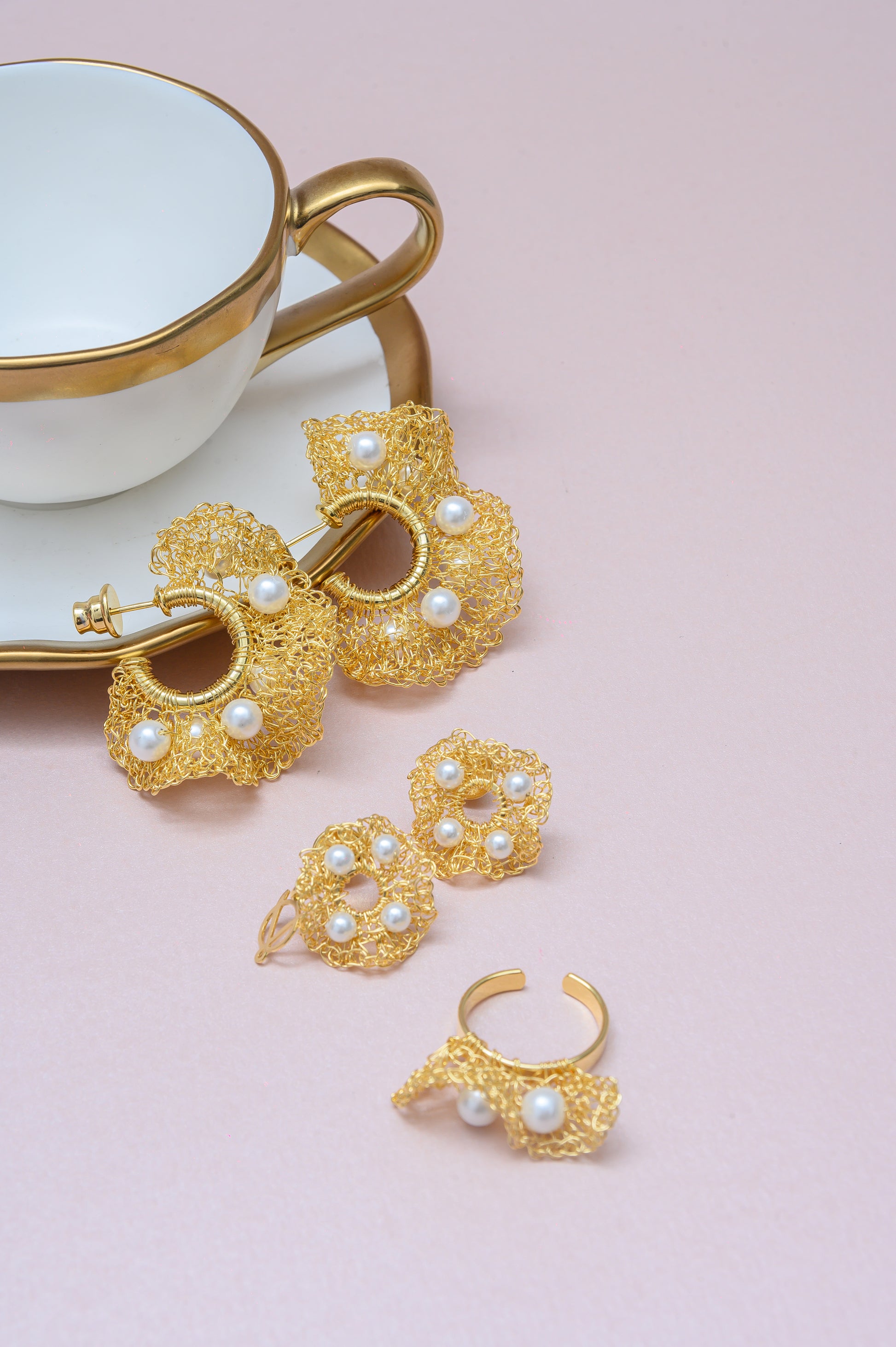 Hand-crocheted pearl ruffle hoop earrings made in Brazil with 18K gold-filled wire. Lightweight, hypoallergenic, nickel-free statement earrings.