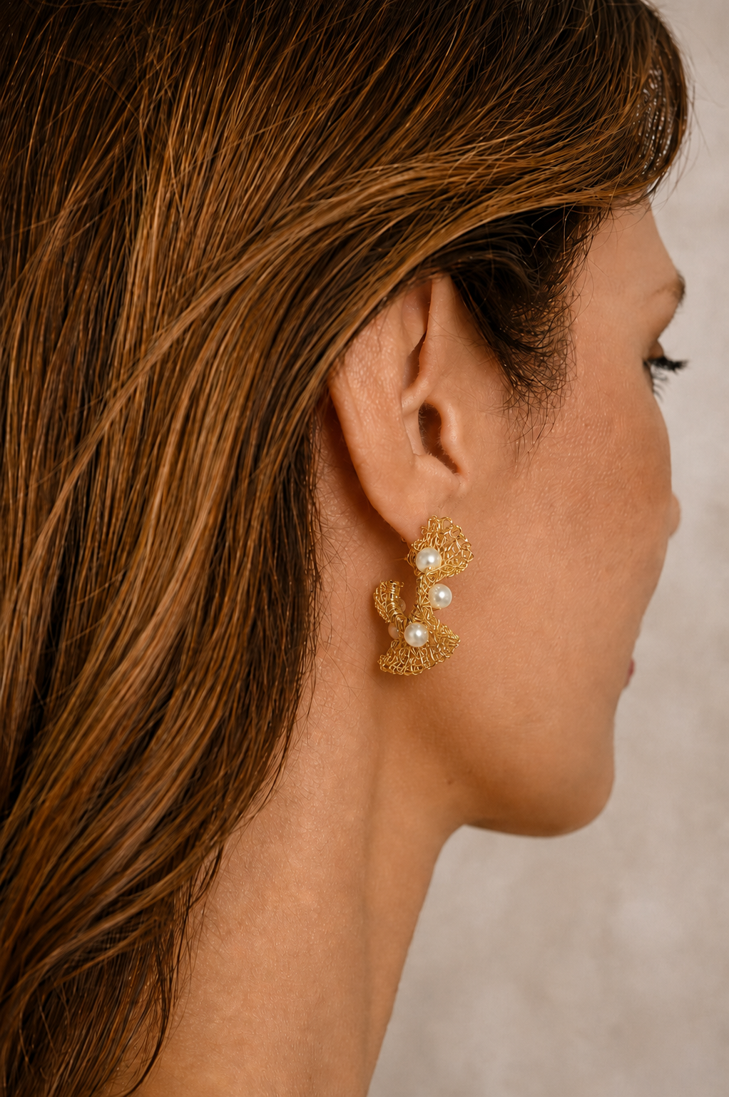 Hand-crocheted pearl ruffle hoop earrings made in Brazil with 18K gold-filled wire. Lightweight, hypoallergenic, nickel-free statement earrings.
