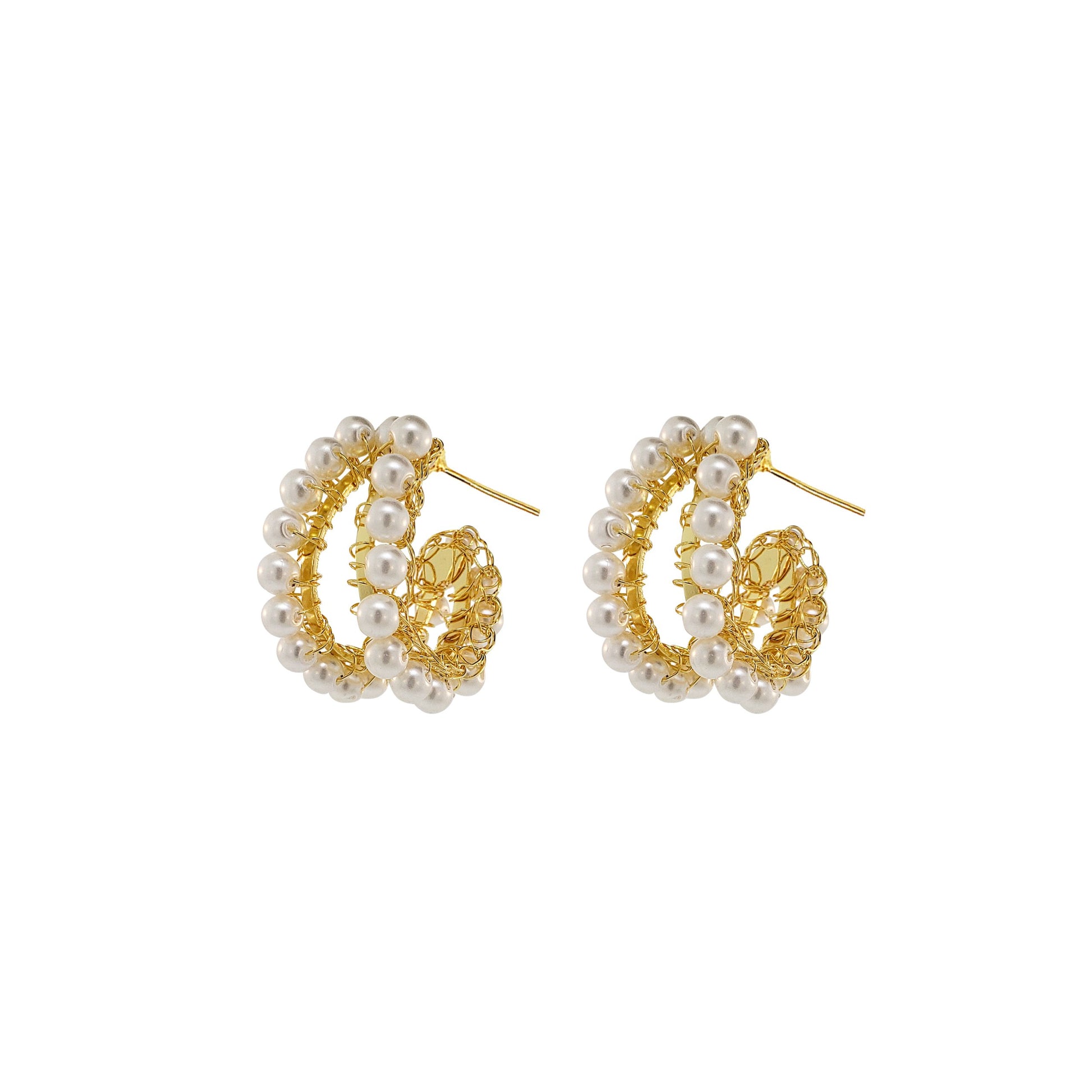 A pair of gold-colored double hand-crocheted hoop earrings with white pearls scattered throughout the design. handmade gold filled hoop earrings, hand crocheted earrings, Brazilian artisan jewelry, lightweight statement earrings, hypoallergenic hoop earrings, nickel free earrings, gold crochet earrings.