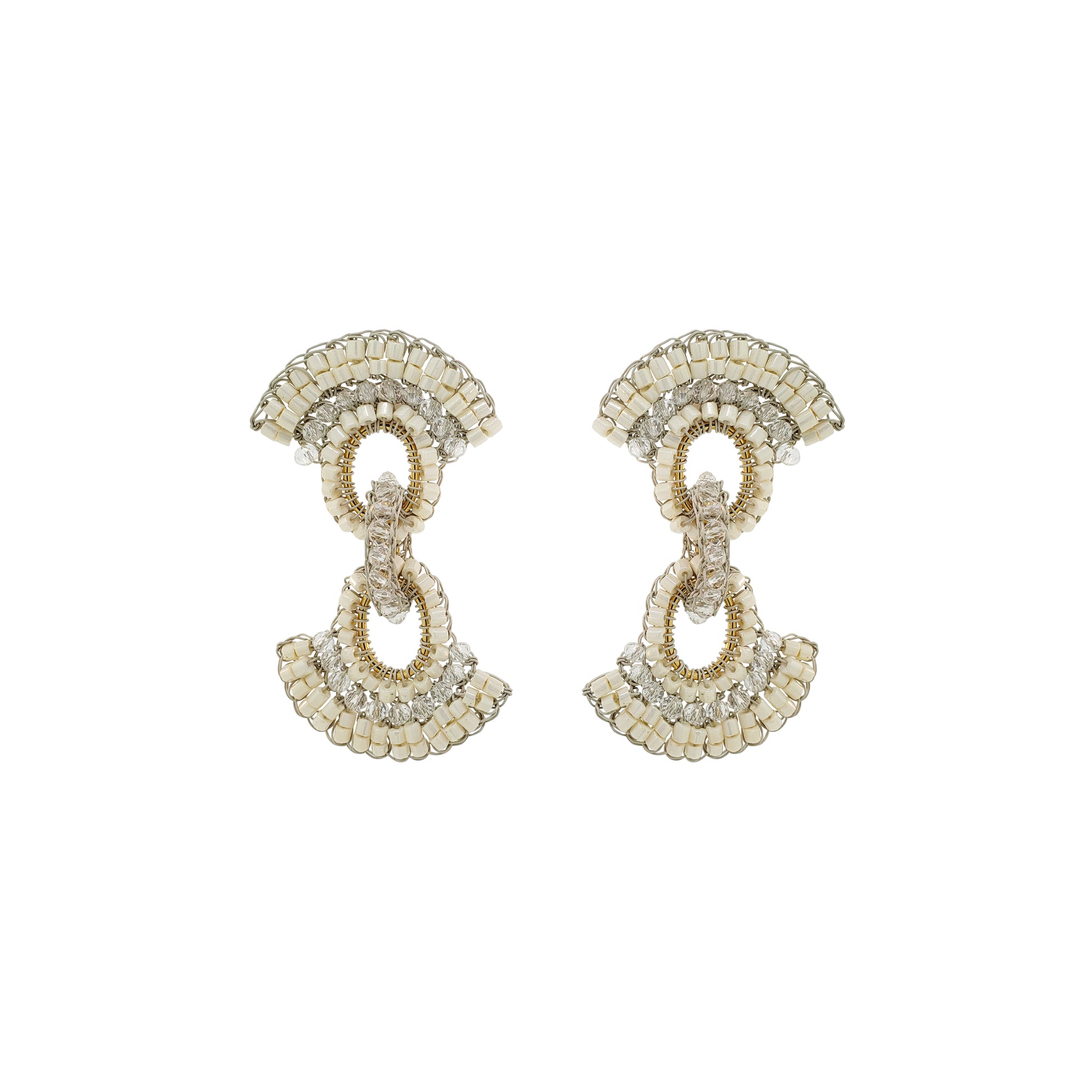 Pair of gold and silver earrings on a white background. Hand-crocheted in Brazil with 18K gold-filled wire, these lightweight colorful crystal earrings feature neutral, pearls and gold details. Hypoallergenic, nickel-free, and perfect for statement styling.