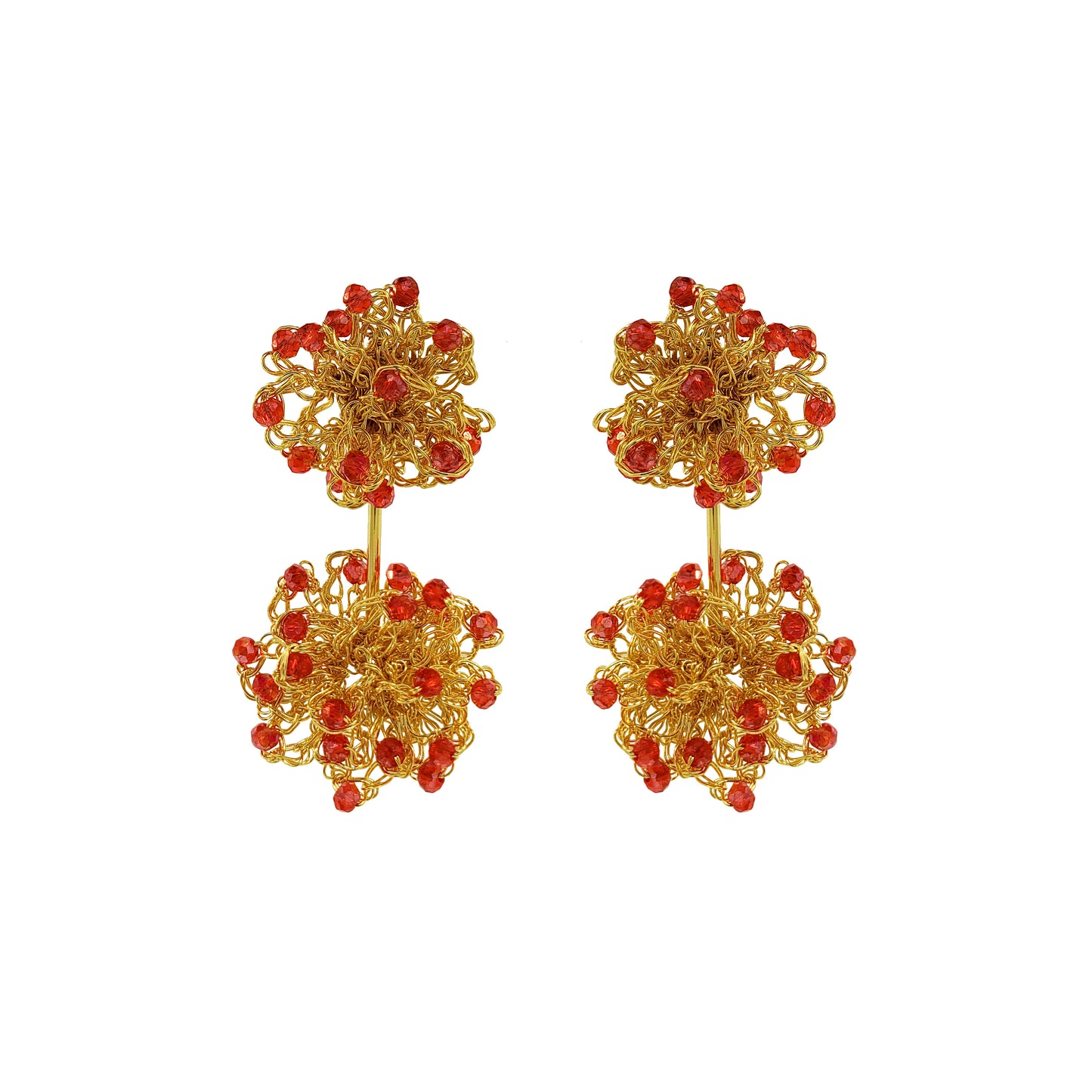 Gold earrings with red beads on a white background. Hand-crocheted double mandala earrings made with 18 karat gold filled wire and red bead accents