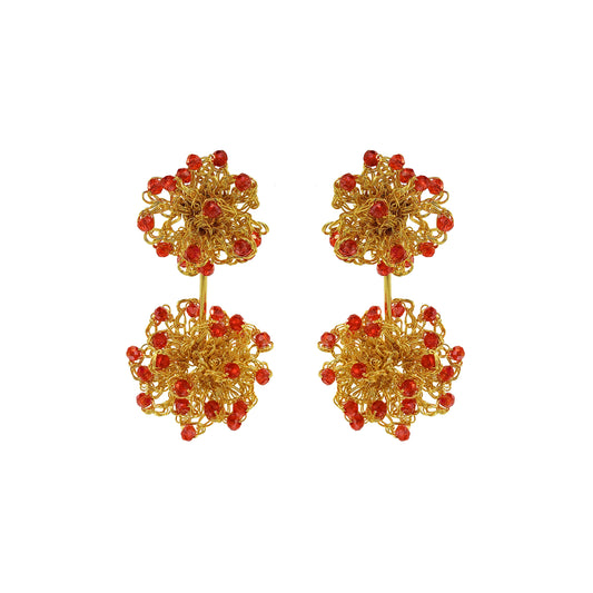 Gold earrings with red beads on a white background. Hand-crocheted double mandala earrings made with 18 karat gold filled wire and red bead accents
