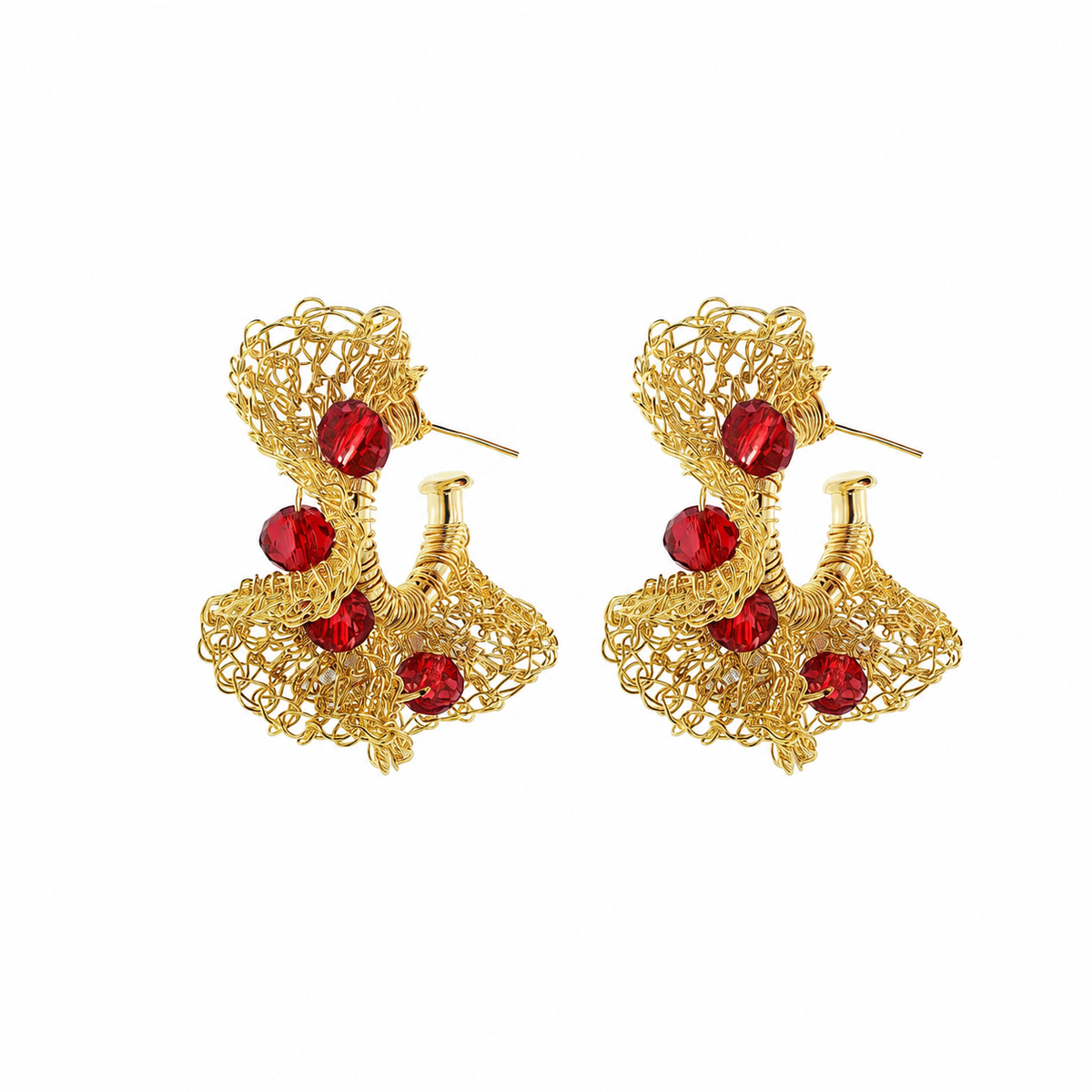 A pair of gold-toned filigree earrings with five faceted red crystal accents, displayed on a clean white background. Hand-crocheted in Brazil, these lightweight 18k gold-filled hoop earrings feature vibrant red crystals and Lavish’s signature artisan crochet technique.