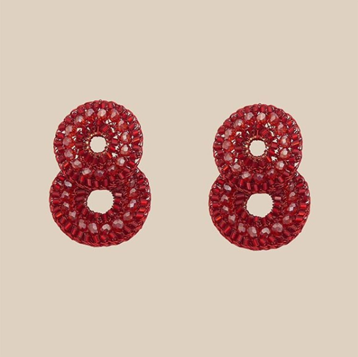 Shop red hand-crocheted cascade earrings made in Brazil with enameled copper wire, sparkling crystals, and glass beads. Lightweight, hypoallergenic, nickel-free, and perfect for statement styling.