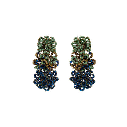 Gold earrings with turquoise stones on a white background. Shop Riviera Mix Drizzle Cascade Earrings, handcrafted in Brazil with 18K gold filled wire and colorful beads. Lightweight, dimensional statement earrings.