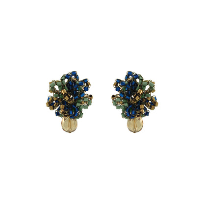 A pair of vintage-style beaded earrings with blue, green, and gold beads, featuring a faceted gold bead at the bottom, shown on a plain white background. Discover Riviera Mix Drizzle Mini Post Earrings, handcrafted in Brazil with 18K gold-filled wire, colorful beads and a sparkling crystal drop.