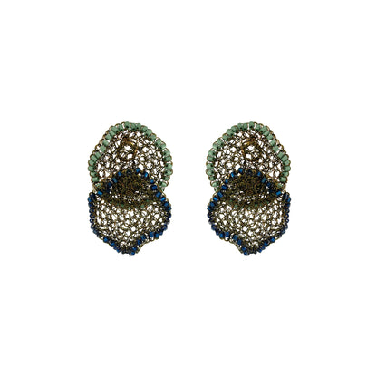 A pair of statement earrings featuring a three-tiered scalloped design with green beads on the top tier, a bronze-toned mesh center, and a bottom tier accented with dark blue beads, shown on a plain white background. Shop Riviera Mix Jasmine Duo Earrings, handcrafted in Brazil with 18K gold filled and enameled wire. Lightweight floral statement earrings in sage green and deep blue.