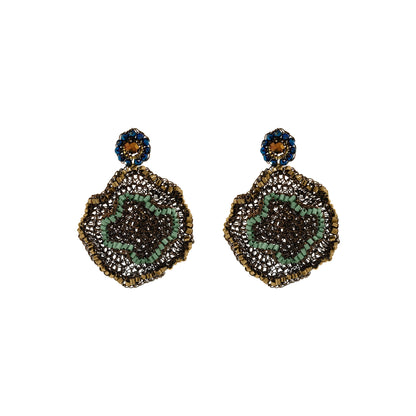 Pair of gold earrings on a white background. Riviera Mix Jasmine handmade crochet earrings featuring sculptural floral drops in gold, soft green and deep blue with sparkling crystal accents.