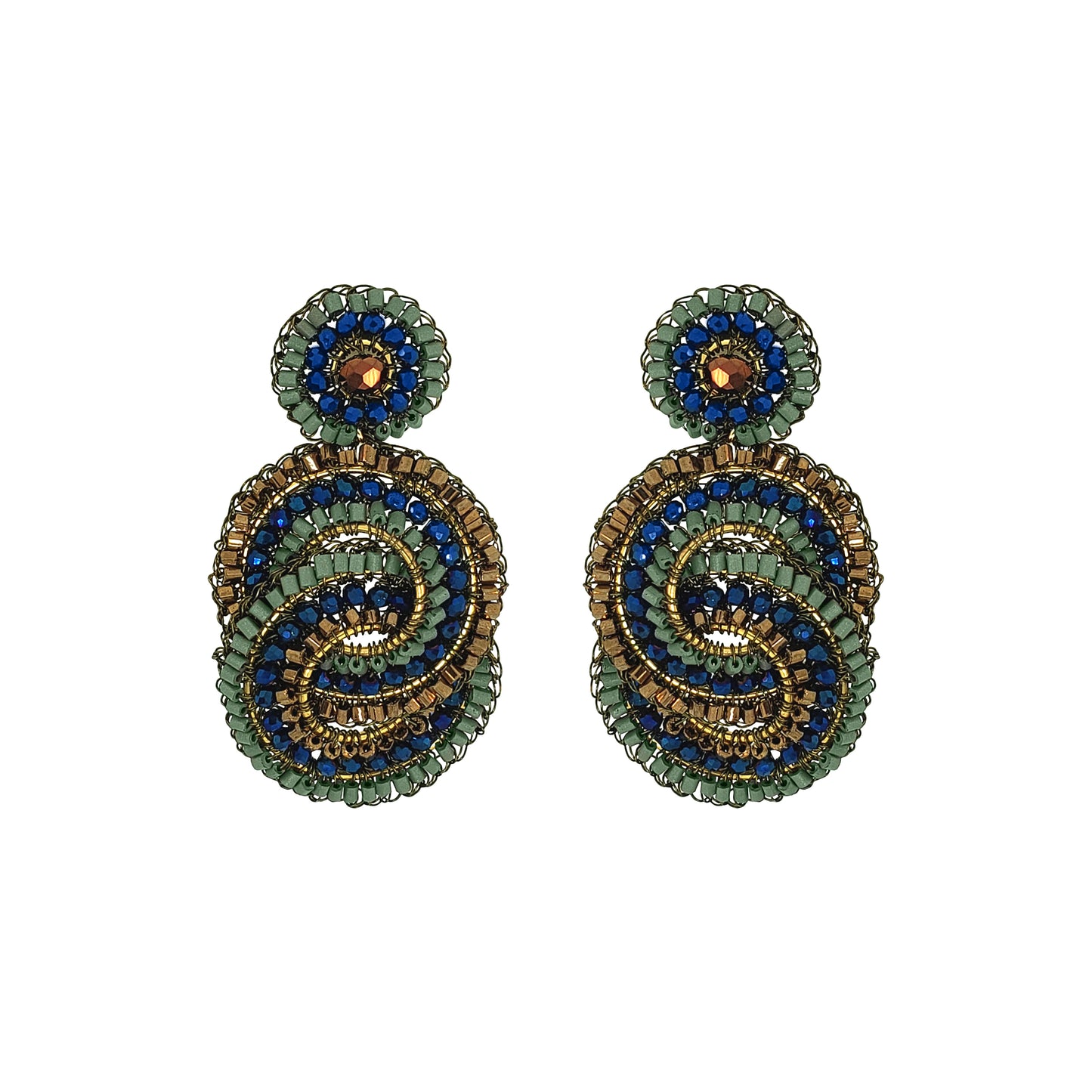 A pair of handmade beaded drop earrings featuring a spiral design in green, blue, and gold, with a small round green and blue top piece on each earring, set against a plain white background. Shop Riviera Mix Loki Earrings, handcrafted in Brazil with 18K gold filled and enameled wire, colorful crystals and intricate crochet detailing.