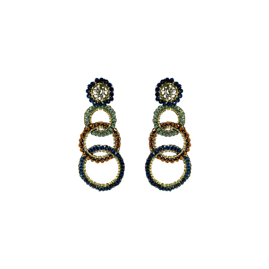 A pair of statement drop earrings featuring stacked interlocking rings in navy blue, emerald green, and gold, with a floral stud top, shown on a plain white background. Shop Riviera Mix Olympia Earrings, handcrafted in Brazil with 18K gold filled wire and colorful crystal-accented links. Lightweight, bold and unique.
