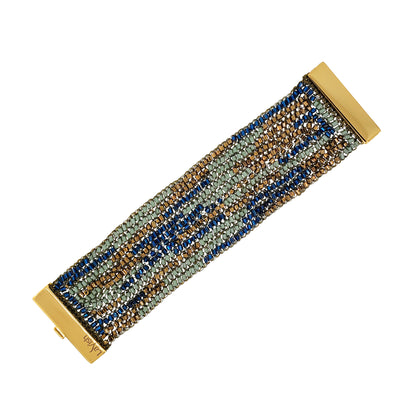Beaded bracelet with gold clasp on a white background. Shop the Riviera Mix Signature Bracelet, handcrafted in Brazil with intricate crochet wirework in blue, sage green and bronze. Lightweight with a magnetic clasp.