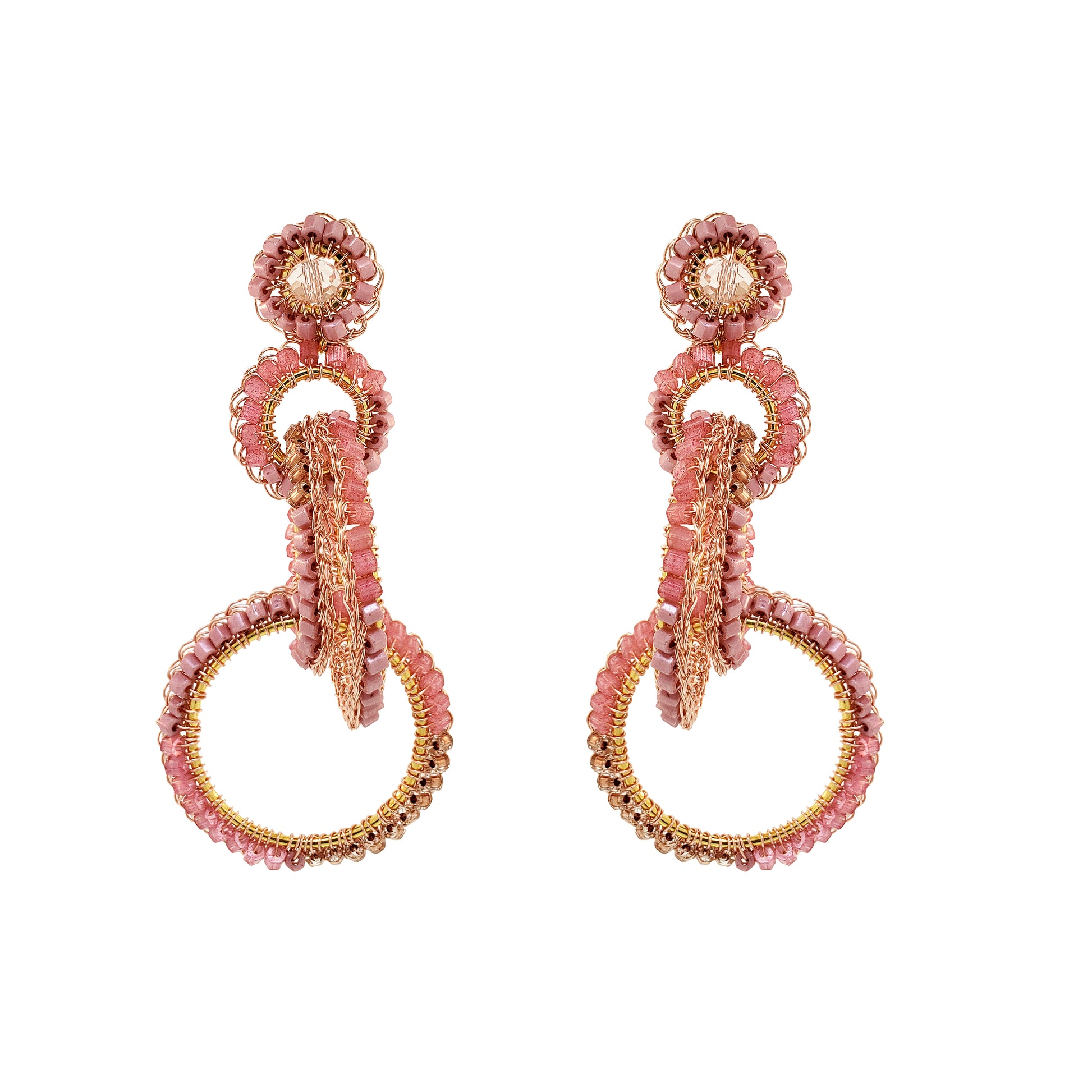 Pair of pink and gold earrings on a white background. Interlocked link hand-crocheted earrings handmade in Brazil with 18 karat rose gold filled wire, soft rose quartz beads, sparkling crystal accents, and layered circular links.