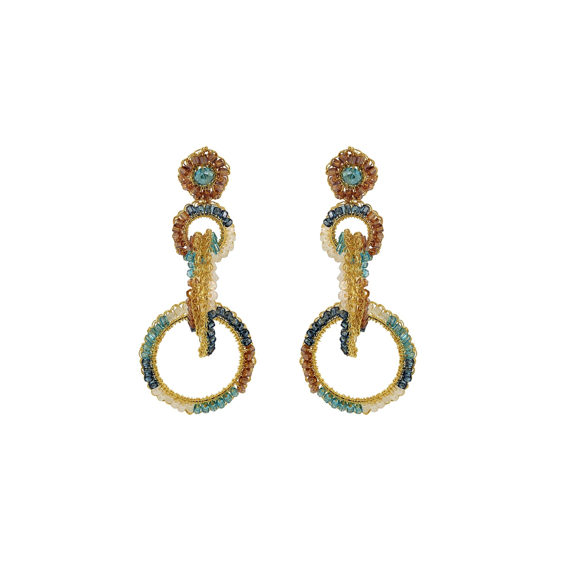 A pair of hand-crocheted earrings with gold-filled wire and blue and clear crystals. Interlocked link hand-crocheted earrings handmade in Brazil with 18 karat gold filled wire, aqua, ivory, champagne, and seafoam blue bead accents, sparkling crystals, and layered circular links.