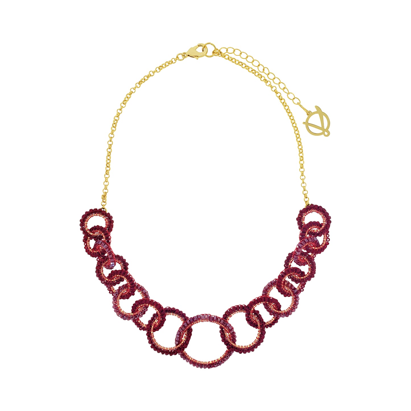 A gold-tone chain necklace featuring a row of interlocking links covered in deep burgundy sequins, presented on a clean white background. Lola handmade statement necklace with interlocking crochet links in burgundy enameled and 18K gold-filled copper wire.