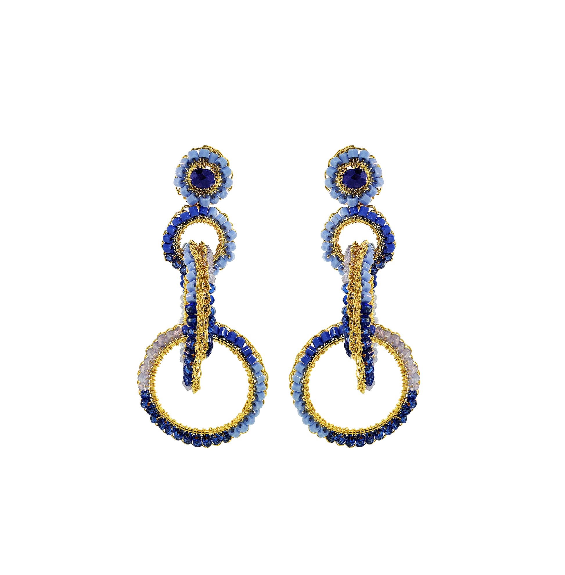 Pair of earrings with blue and gold design on a white background. Interlocked link hand-crocheted earrings handmade in Brazil with 18 karat gold filled wire, rich blue tones, sparkling crystal accents, and layered circular links.