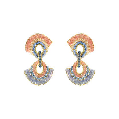 Pair of colorful earrings on a white background. Colorful hand-crocheted statement earrings with coral, blue, lavender, crystal accents, and 18K gold-filled wire, handmade in Brazil