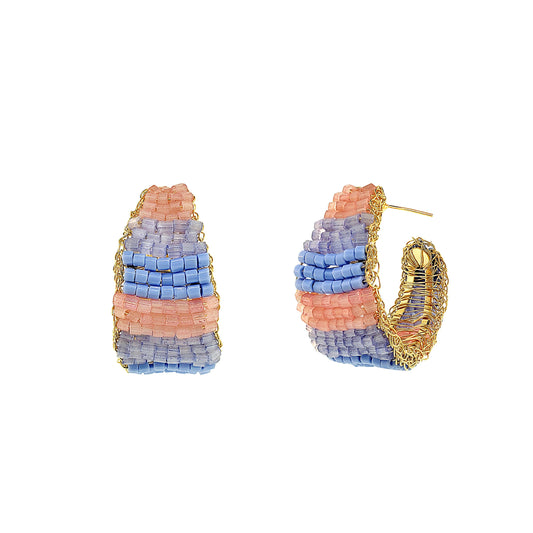Pair of blue beaded hoop earrings with gold accents on a white background. Vibrant handmade crochet hoop earrings with enameled wire and crystals, handcrafted in Brazil by skilled artisans.