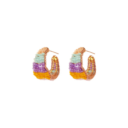 Vibrant handmade crochet hoop earrings with enameled wire and crystals, handcrafted in Brazil by skilled artisans.