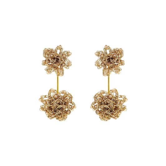 Pair of gold floral earrings on a white background. Hand-crocheted gold double mandala earrings with amber bead accents, handmade in Brazil with 18 karat gold filled wire.