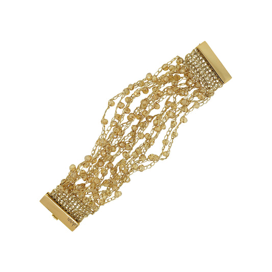 Gold bracelet with multiple chains on a white background. Hand-crocheted gold cuff bracelet handmade in Brazil with 18 karat gold filled and enameled wire, sparkling gold crystal accents, and magnetic clasp.