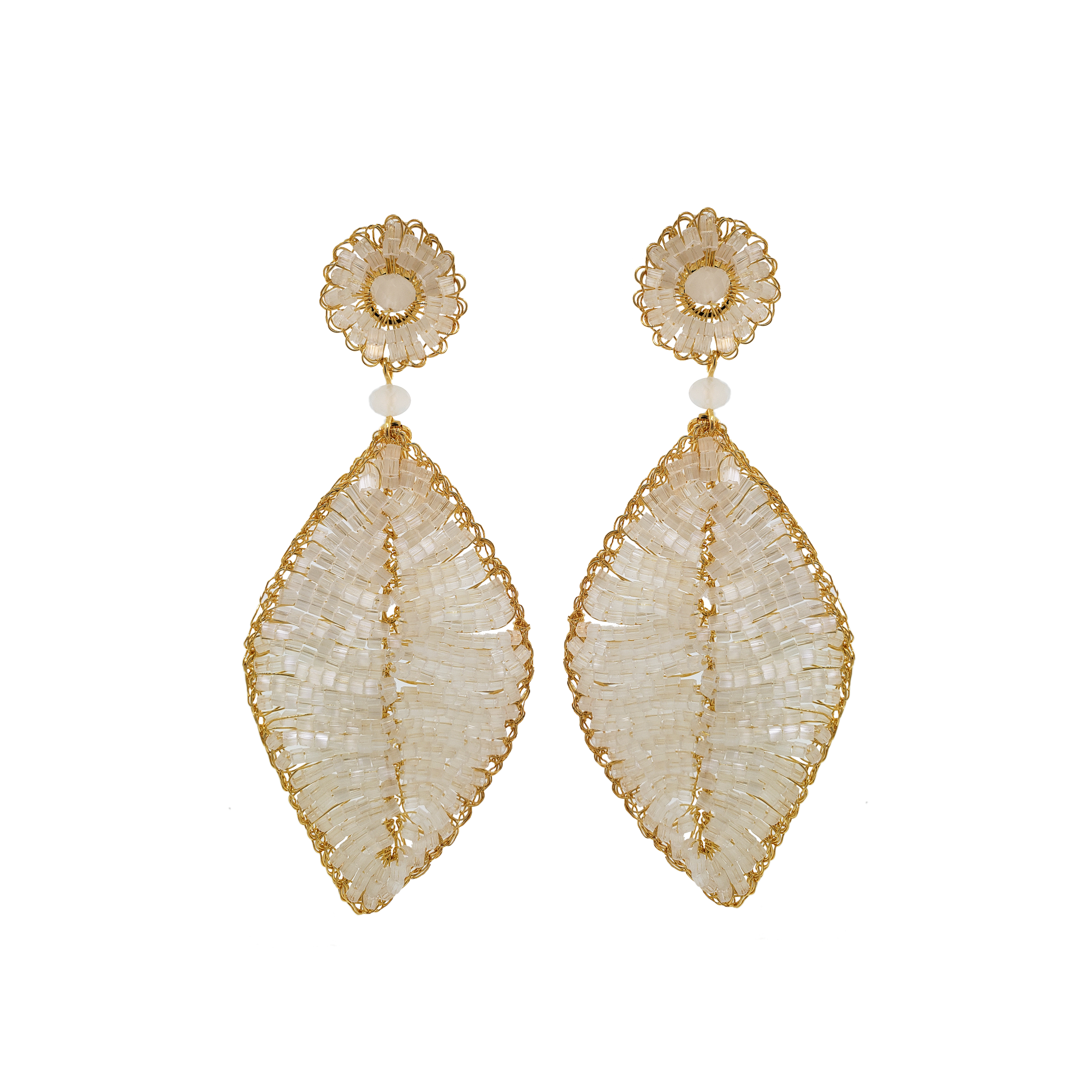 A pair of gold-filled white leaf-shaped earrings with crochet detailing and sparkling crystals at the top. hand-crocheted earrings, 18k gold-filled earrings, leaf earrings, handmade Brazilian jewelry, lightweight statement earrings, hypoallergenic earrings.