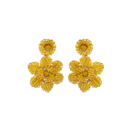 A pair of hand-crocheted yellow floral earrings made with 18 karat gold filled wire. Mini floral hand-crocheted dangle earrings handmade in Brazil with 18 karat gold filled wire and warm golden-yellow bead accents.