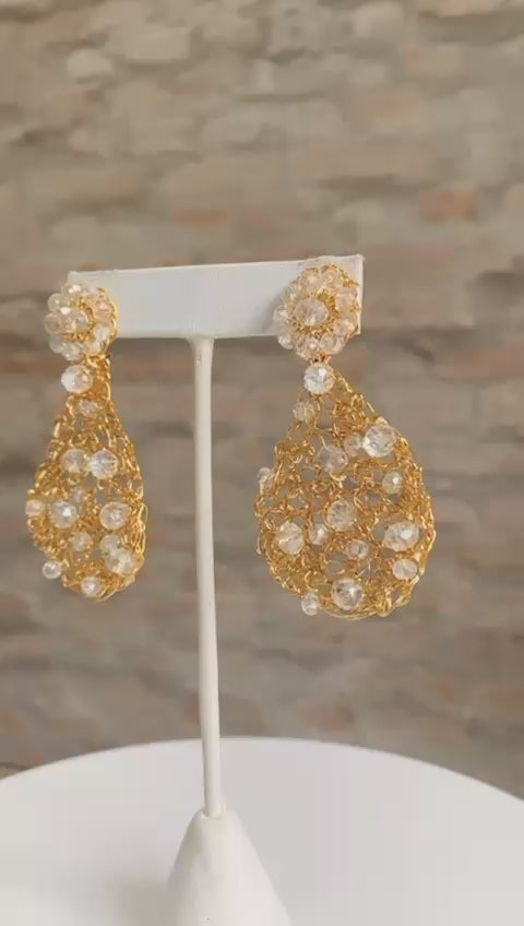 Handmade in Brazil, these teardrop mesh earrings feature 18 karat gold filled wire, multicolor crystals, lightweight comfort, and hypoallergenic materials. 3324-001-007