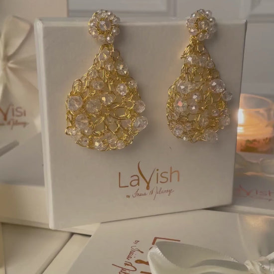 Handmade in Brazil, these teardrop mesh earrings feature 18 karat gold filled wire, multicolor crystals, lightweight comfort, and hypoallergenic materials. 3324-001-007

