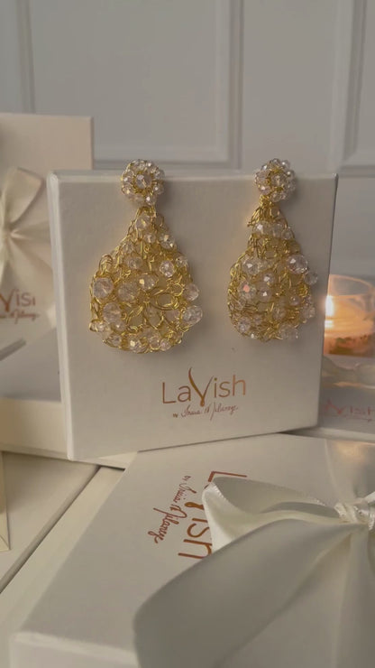 Handmade in Brazil, these teardrop mesh earrings feature 18 karat gold filled wire, multicolor crystals, lightweight comfort, and hypoallergenic materials. 3324-001-007
